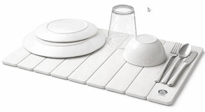 Stone dish drying mat with dishes and cutlery